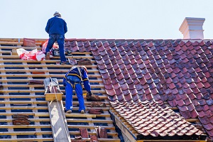 roof repair of a historic house and replacement of clay tiles
