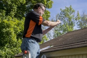 roofing expert inspecting roof