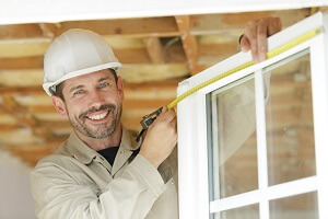 a happy man measuring window