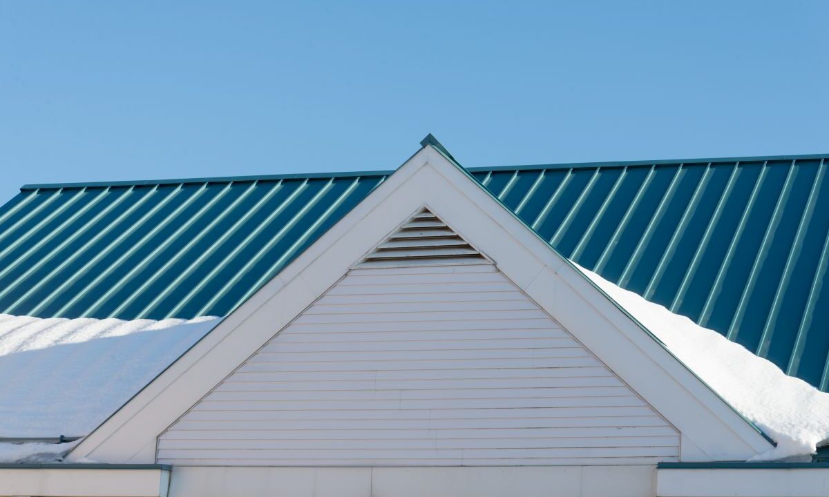 Snow on lower portion of a metal roof