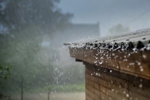 rain flows down from a roof down
